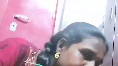 Mature tattooed Tamil wife giving handjob to husband
