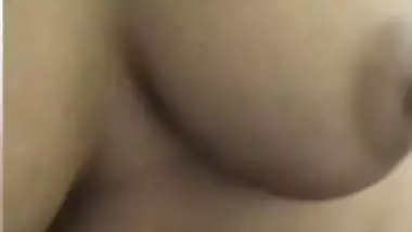 Chubby shy Indian girl showing round boobs to lover